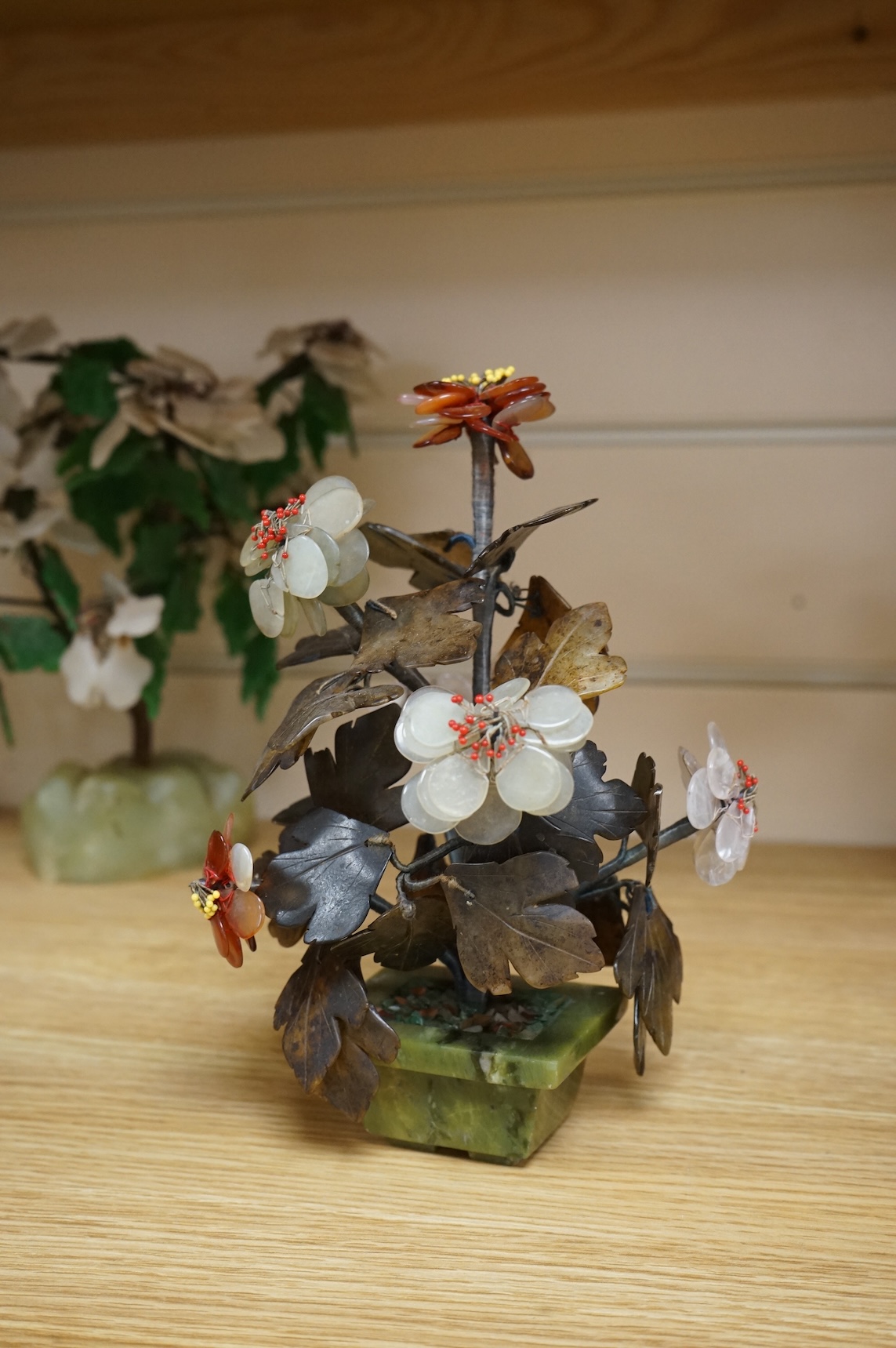 A collection of four ornamental Chinese hardstone flowering trees, tallest 22cm.